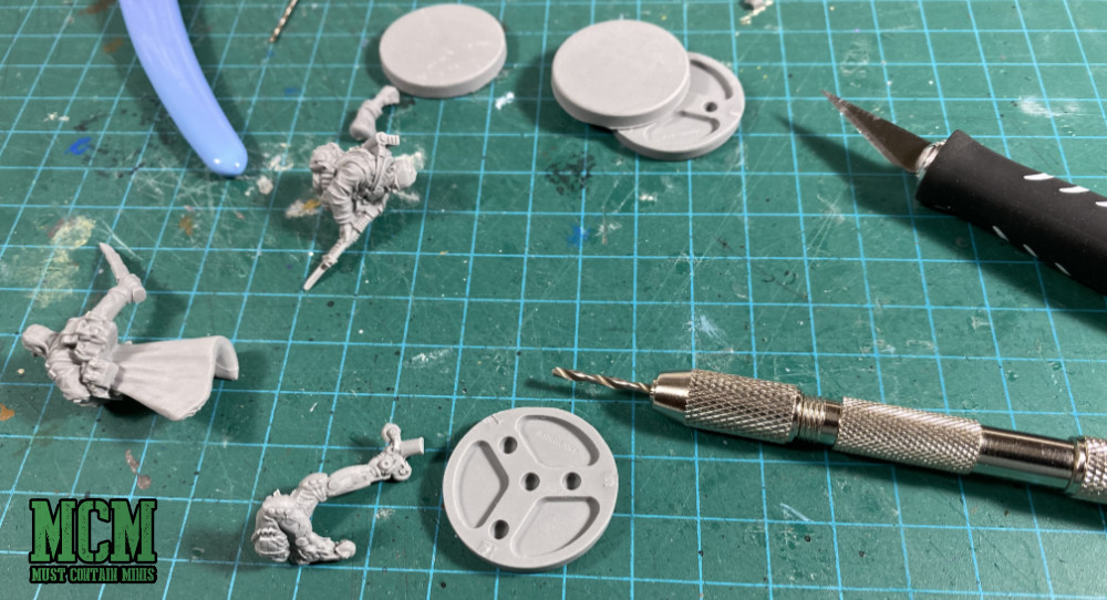 Building Monster Fight Club Miniatures - use the pegs to attach the models to the bases.