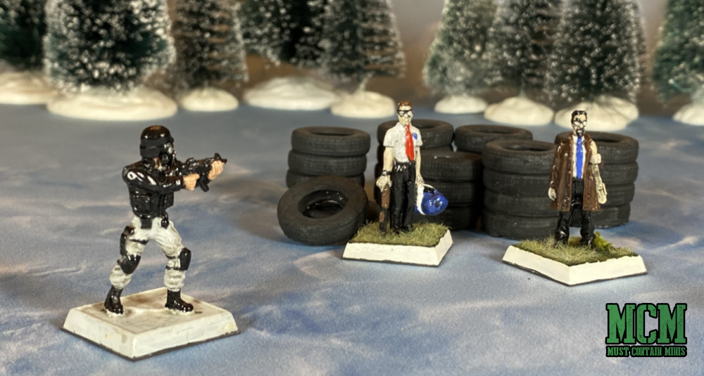 RAFM Miniatures along side Six Squared Studios tires on a Cardboard Dungeon Games.