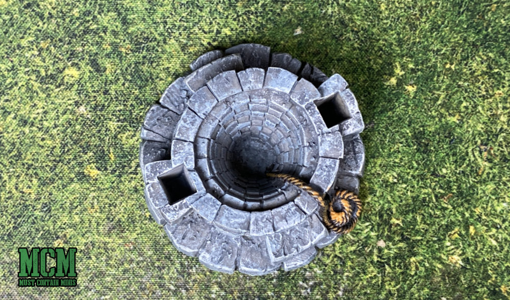 An optical illusion to make the terrain piece look like it has a deeper pit than it really does - miniature gaming terrain