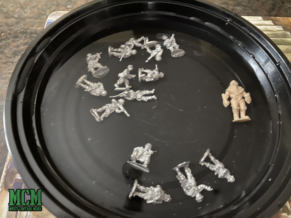 Giving miniatures a bath to wash them off... 