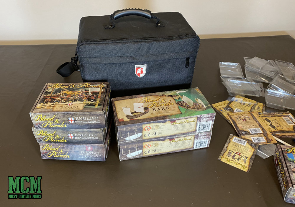 In my latest video, I unbox the following products by Firelock Games for Blood and Plunder. The Pirates And Privateers Set, European Colonial Militia Set, English Nationality Starter Set, The Bark, The Longboat, Multiple Blisters not in the sets above. While I unbox the minis, I also place them in this case. Unboxing Blood & Plunder Starter Sets