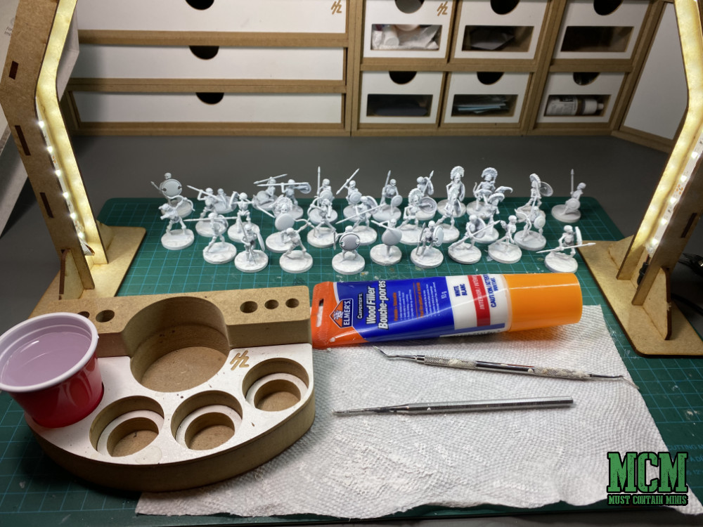 How to Prep Plastic Miniatures for Painting - How to deal with an integrated base - method one - Spackle or wood filler