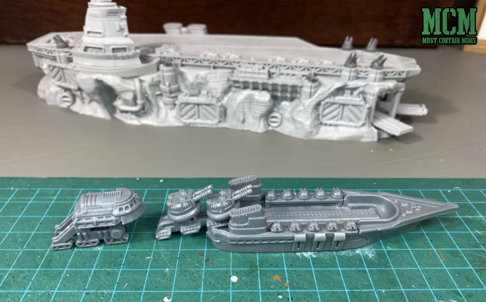 Dystopian Wars - trains loading guns onto a ship