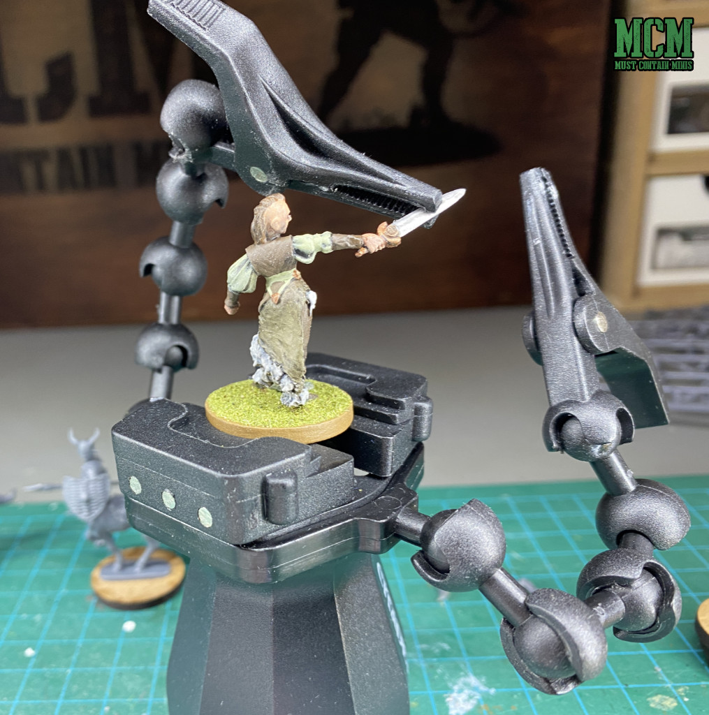 How to glue a broken sword back onto a miniature.