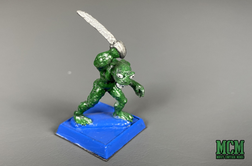 One of the Deep Ones miniatures armed with a sword