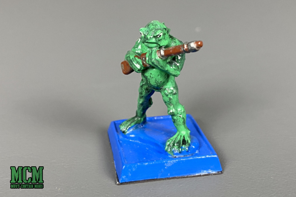 one of the 28mm Deep Ones miniatures armed with a rifle