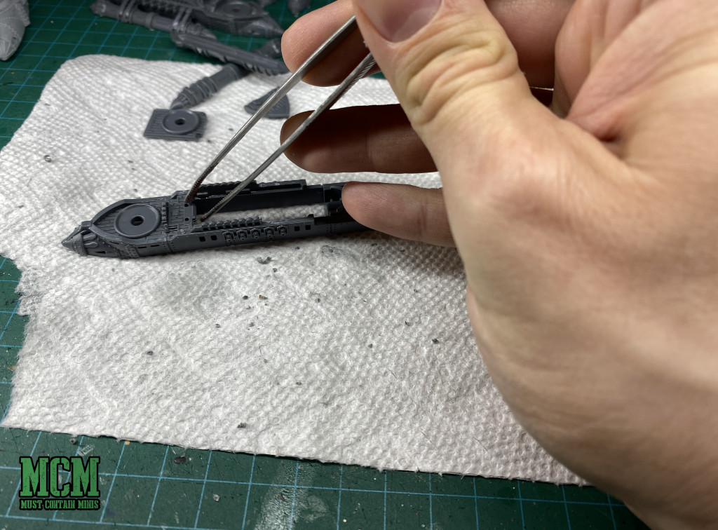 Tweezers help with building small miniatures. 