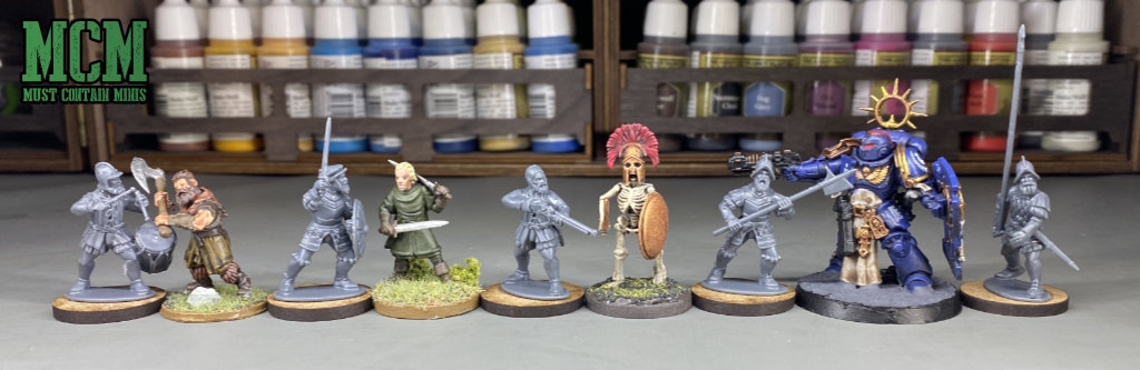 Scale comparison image of Wargames Atlantic Conquistadors miniatures to other figures 