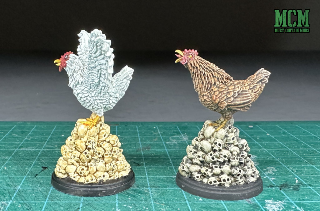 Angry Chicken miniatures on a pile of skulls