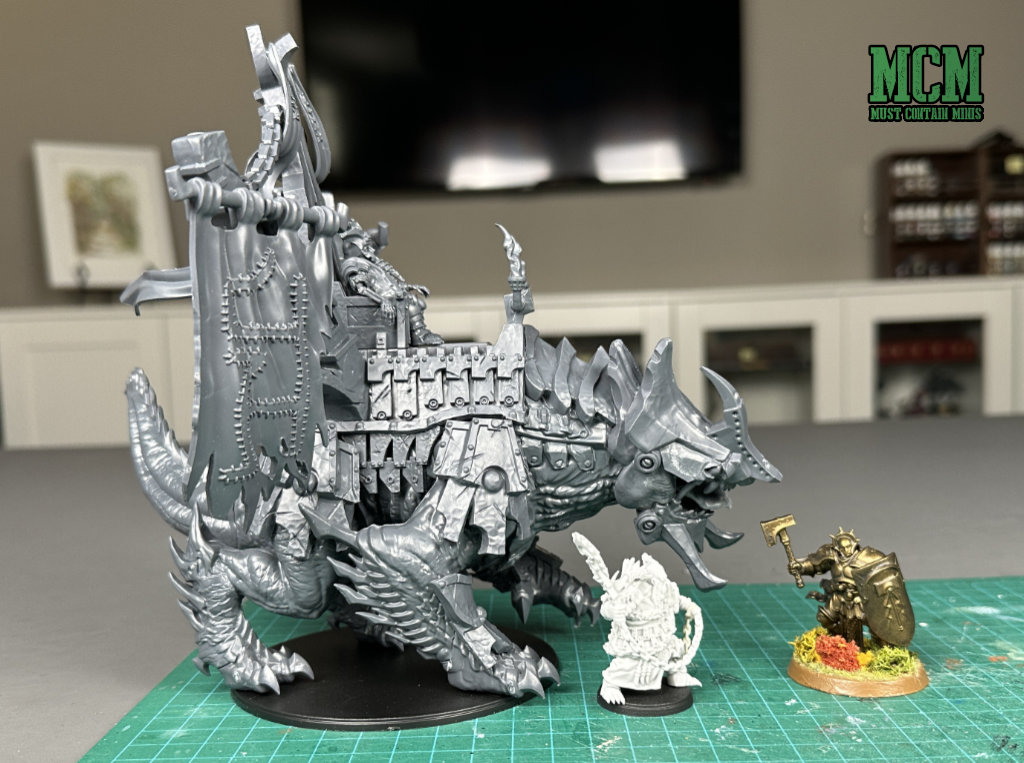 Conquest Dweghom miniatures compared to the size of an Age of Sigmar miniature. 