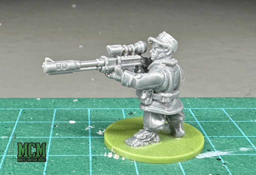 A serious Sneakfoot (proxy Ratling) with a large sniper rifle 